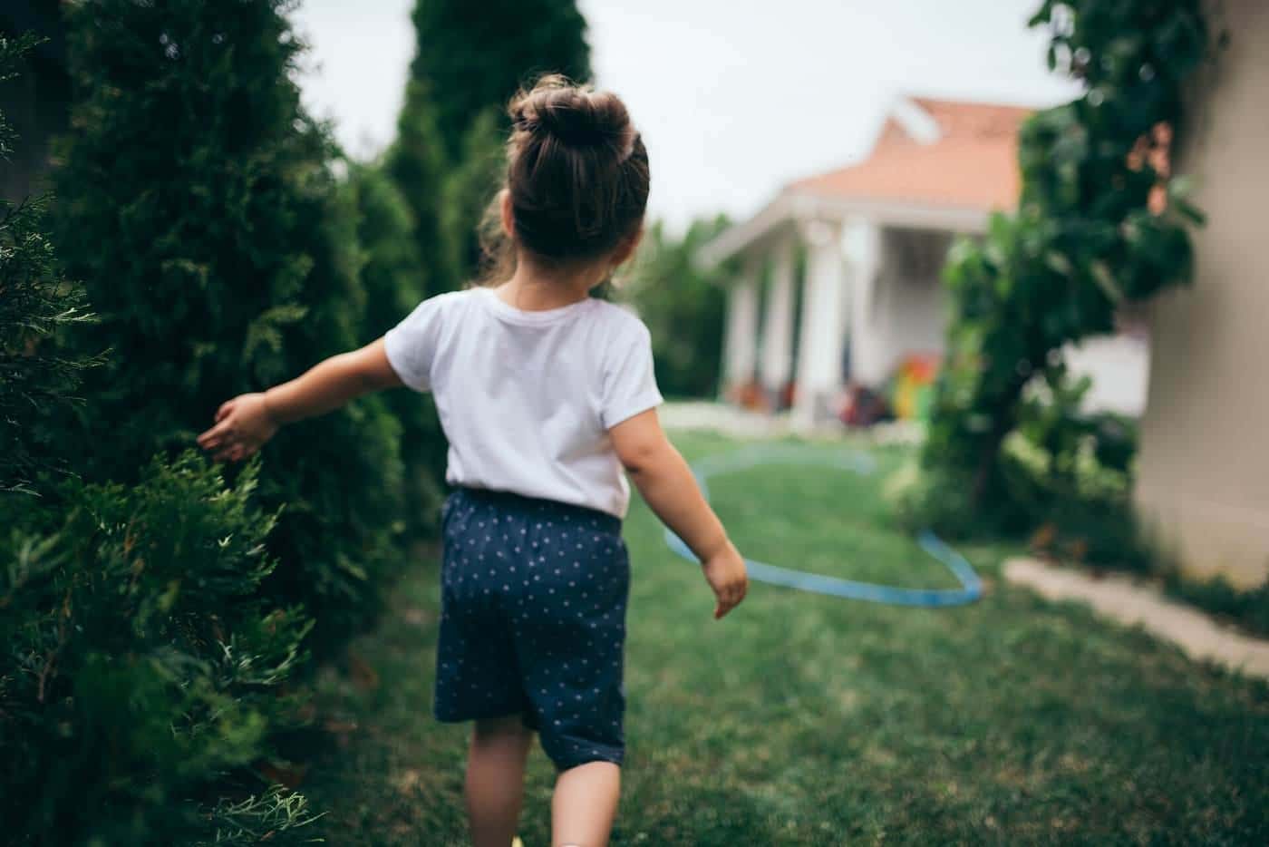 A child playing in a backyard